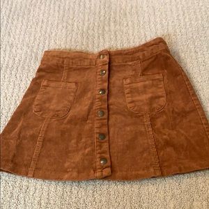 Brandy Melville rust colored corduroy skirt.